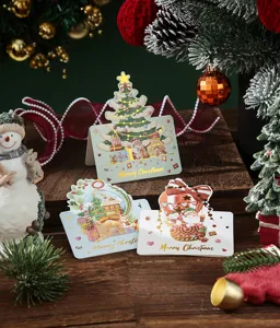 Detail shot of festive Christmas greeting cards with elegant gold foil stamping design.