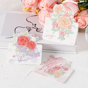 Close-up of hand-painted floral greeting cards with roses for Valentine's Day