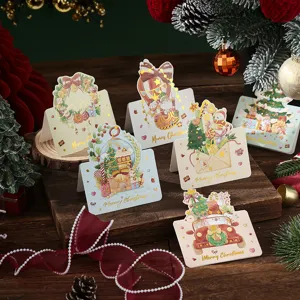 Set of Christmas greeting cards with gold foil stamping and holiday illustrations.