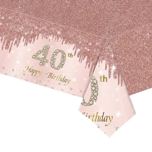 Détail d'une nappe jetable or rose à paillettes pour le 40ème anniversaire de fête.