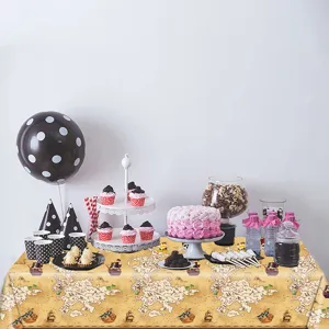 Detailed view of pirate treasure map tablecloth at a themed birthday party scene