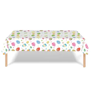 Full view of a white disposable PE tablecloth decorated with colorful Easter egg patterns