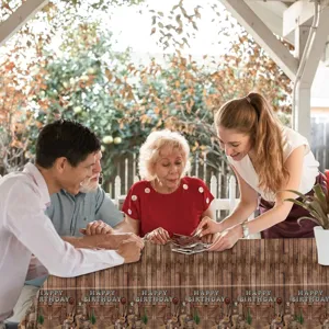 Close-up of cowboy wood grain happy birthday disposable party tablecloth in use scene
