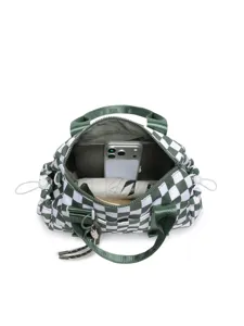 Interior view of a green checkered travel bag showing storage capacity for tablet and phone
