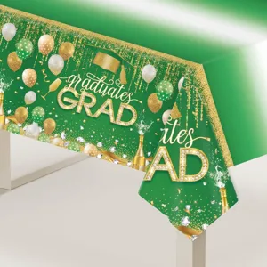 Détail de la nappe de remise des diplômes verte avec paillettes dorées et ballons.