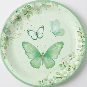 Détail d'une assiette en carton avec un élégant motif de papillon vert et de feuilles.