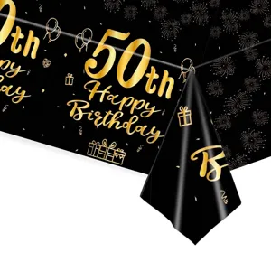 Detailansicht einer Tischdecke zum 50. Geburtstag mit goldenen Feuerwerks- und Ballondekoren.