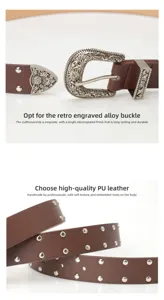 Detail of vintage floral engraved buckle and silver studs on brown PU leather belt