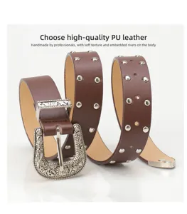 Detail view of brown retro belt with silver studs and intricately engraved metal buckle.