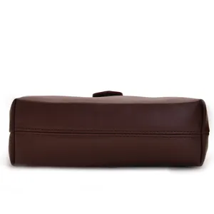 Detailed bottom view of a vintage dark brown leather doctor bag with neat stitching.