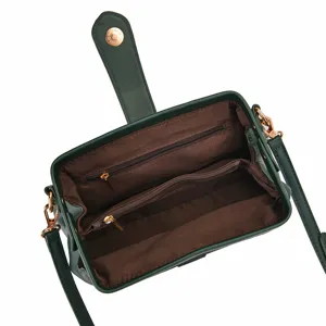 Detailed interior view of vintage green doctor bag with multiple zipper compartments