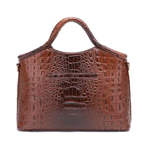 Vista detallada de un bolso vintage marrón con textura de cocodrilo en relieve.