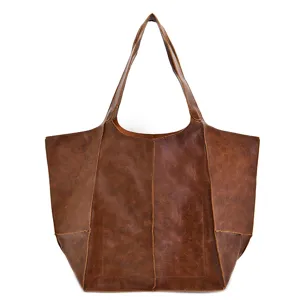 Vista frontal detallada del bolso tote vintage de cuero encerado marrón muy suave