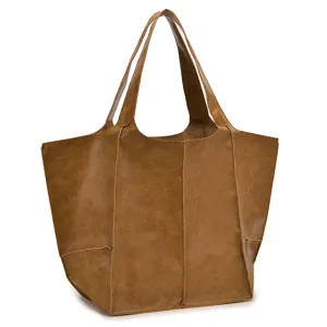 Vista detallada de un bolso tote de cuero encerado marrón vintage con costuras decorativas.