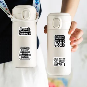 Close-up detail of black inspirational quote text stickers displayed on white water bottles.