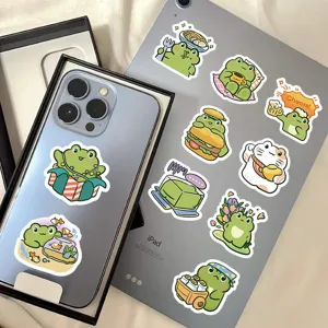 Set of cute cartoon frog stickers and lucky cat decals displayed on tablet and smartphone