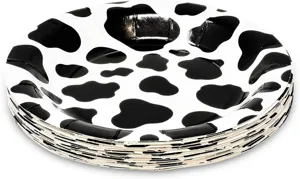 Pile d'assiettes en papier jetables avec motif de vache noir et blanc pour fête décor