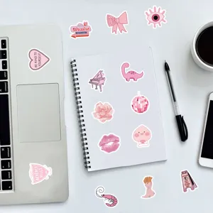 Pink aesthetic waterproof cute stickers detail shot showing laptop and notebook decor setup.