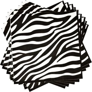 Gros plan détaillé de serviettes en papier jetables avec motif zébré noir et blanc chic