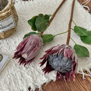 Close-up of artificial burgundy King Protea stems with realistic textures for home decor.