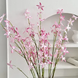 Close-up detail of realistic pink artificial oncidium orchid branches for home decor