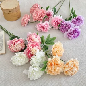 Macro view of high-quality artificial silk peonies in various colors for home decoration