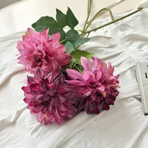 Detailed view of vintage artificial dahlia flowers with realistic fire-roasted edges