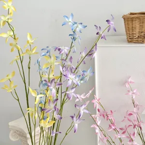 Close-up view of vibrant artificial dancing lady orchids in yellow, blue, and pink colors