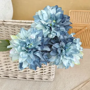 Close-up of beautiful blue artificial dahlia flowers with vintage burnt edge petals