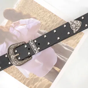 Retro black leather belt with silver studs and engraved buckle for women's jeans.