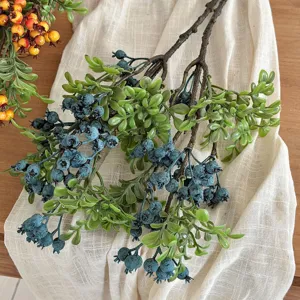Detailed view of realistic artificial blueberry branches and leaves for home decoration
