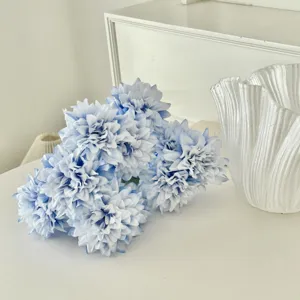 Detailed macro view of light blue artificial dahlia flowers for elegant home decor