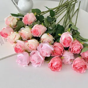 Detail shot of artificial Bulgarian roses in pink and cream hues for home decoration