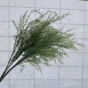 Close-up detail of realistic artificial green asparagus grass for shop decoration
