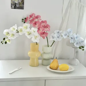 Detailed view of realistic 70cm 9-head artificial Phalaenopsis orchids for home decor.