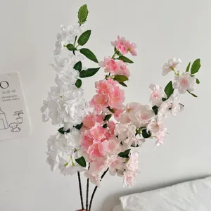 Close-up of realistic artificial cherry blossom branches for home and wedding decor