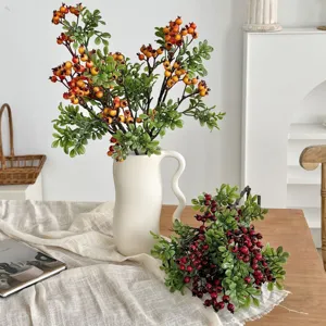 Lifelike artificial red and orange berry branches for home decor arrangement.