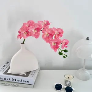 Realistic 70cm 9-head pink Phalaenopsis orchid stem for elegant home decor scene.