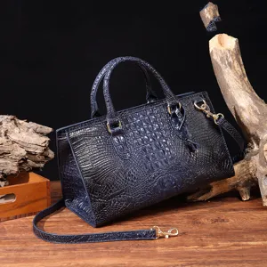 Elegante bolso de mano vintage azul oscuro con patrón de cocodrilo y correa ajustable