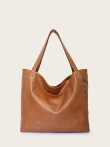 Vista frontal de un gran bolso tote vintage de cuero marrón de textura suave