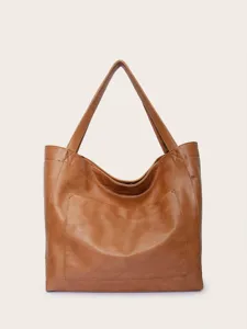 Vista frontal detallada de un bolso tote grande de cuero marrón vintage con bolsillo frontal