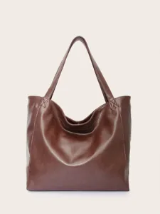 Vista detallada del bolso tote grande de cuero encerado marrón con textura vintage