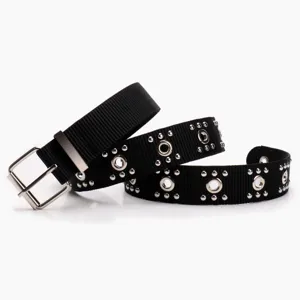 Punk style black belt with decorative metal studs and grommets for jeans and trousers
