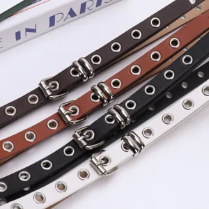 Vintage American punk style belts with all-over metal eyelets for women