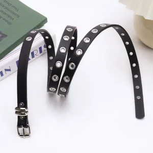 Black punk style faux leather belt with full metal grommets and silver buckle