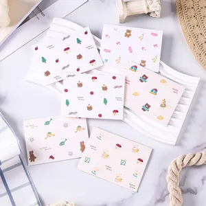 Detailed macro view of various cartoon animal greeting cards with bear and rabbit prints