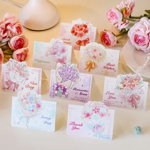 Detail shot of 3D bouquet greeting cards with elegant floral patterns and English text.