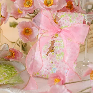 Detailed view of elegant pink floral greeting card with large pink organza ribbon bow
