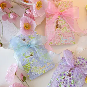 Detail of floral greeting cards featuring elegant sheer ribbon bows and Thank You text.