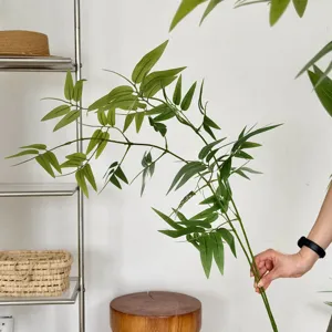 Detailed view of a realistic artificial green bamboo branch for Zen-style interiors